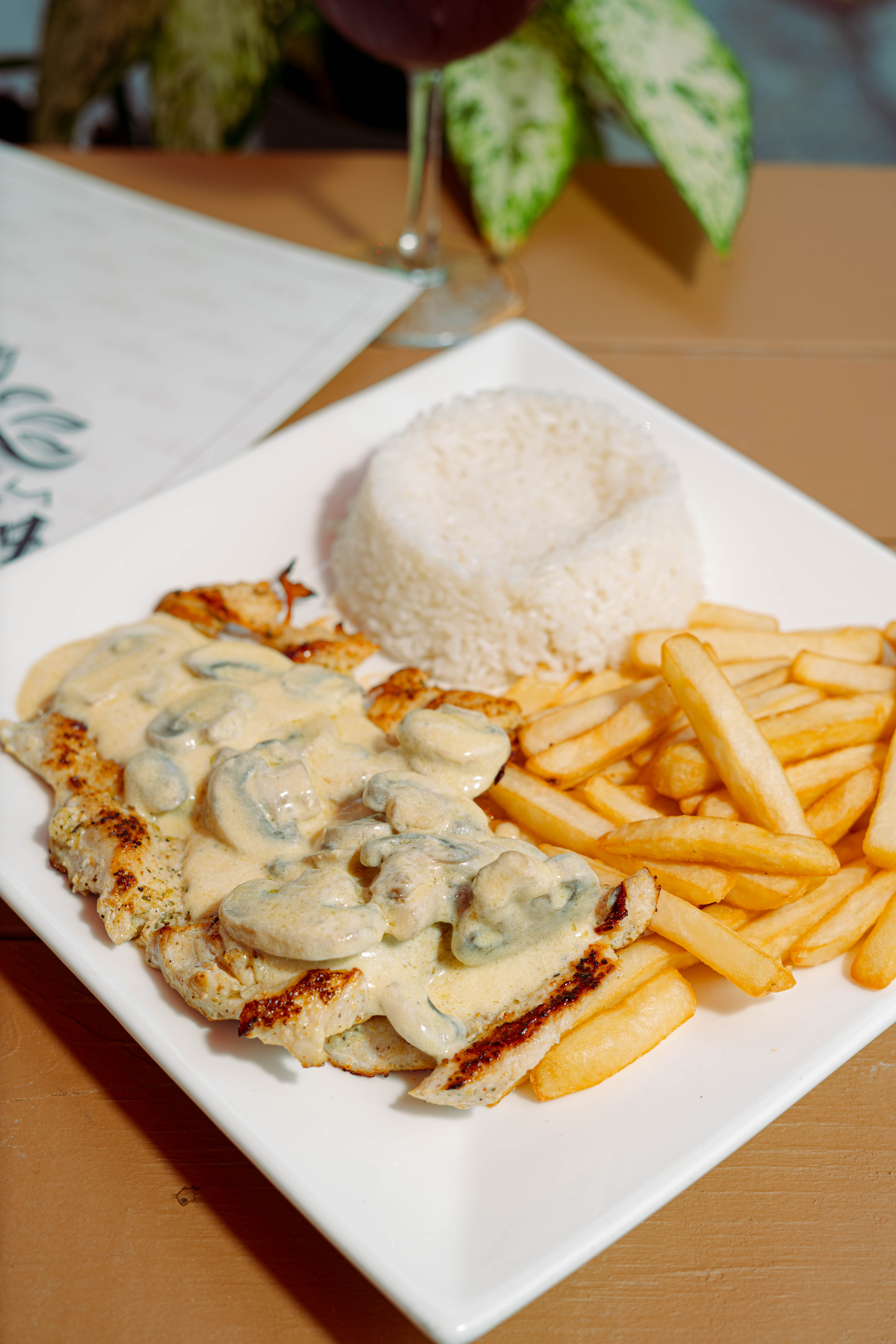 Grilled chicken breast smothered in mushroom sauce