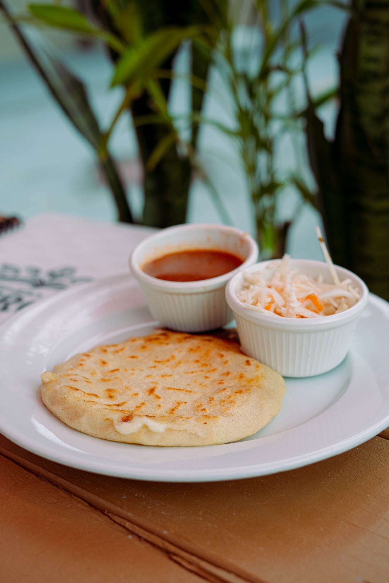 Pupusa with curtido and salsa